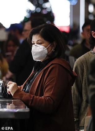 Los Angeles County is under a mask advisory after officials warned a mandate could come soon in the state earlier this month. Pictured: A woman wears a mask at an LA marketplace