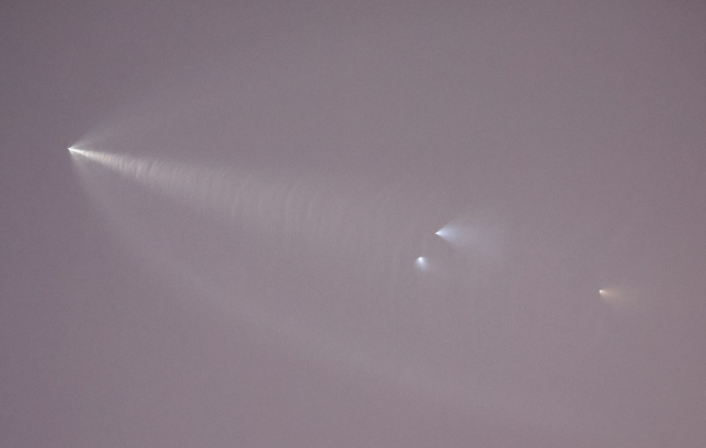The SpaceX Falcon 9 rocket rises ahead of the rocket's vapor trail after launching from Vandenberg Space Force Base carrying 53 Starlink satellites on October 27, 2022 in Los Angeles, California.