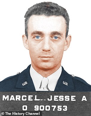 Roswell base intel officer Major Jesse Marcel (above) has claimed he was forced to pose before reporters with weather-balloon debris that he did not witness at the Roswell UFO crash site