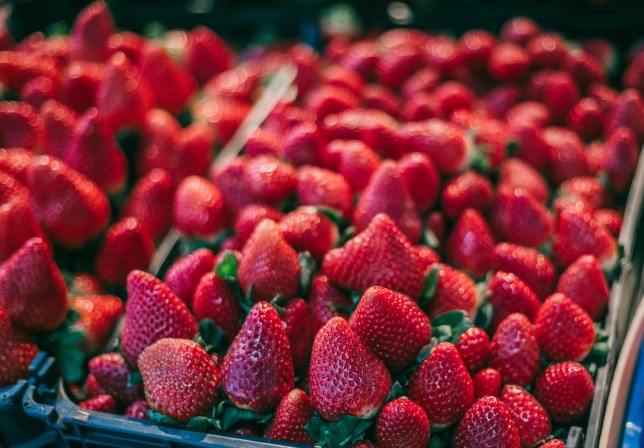 strawberries displayed in market stall